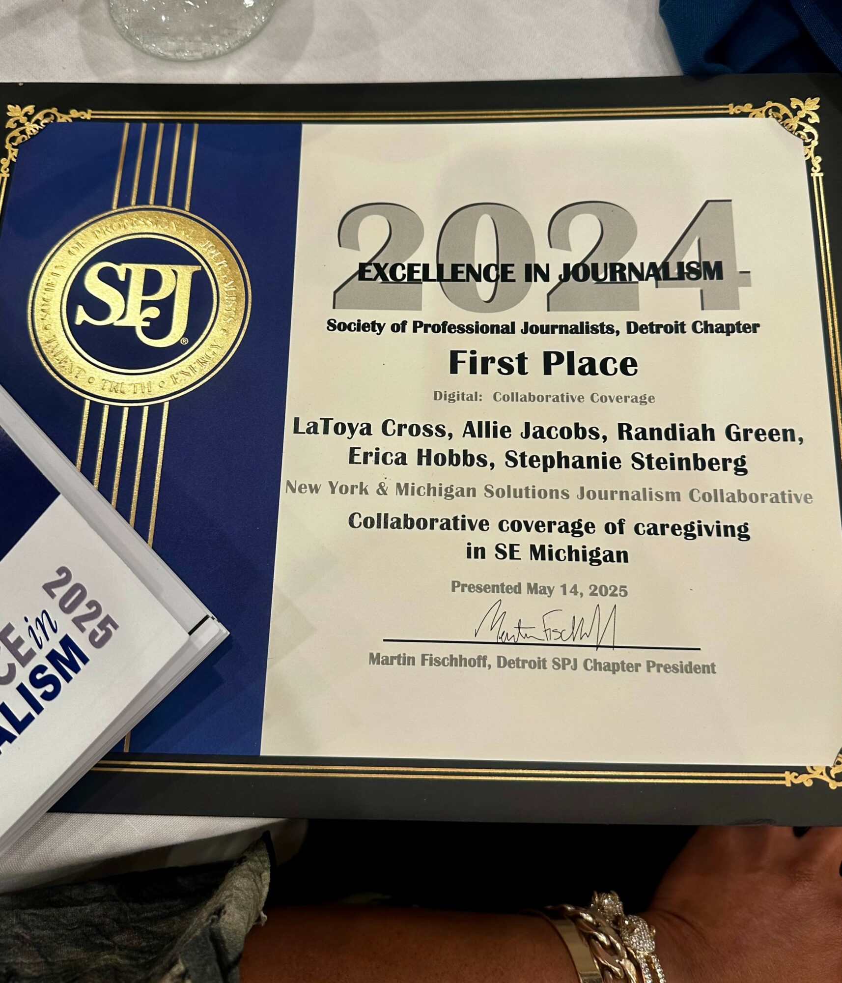 Certificate awarded for first place in journalism, presented to LaToya Cross and others, with SPI logo and decorative border.
