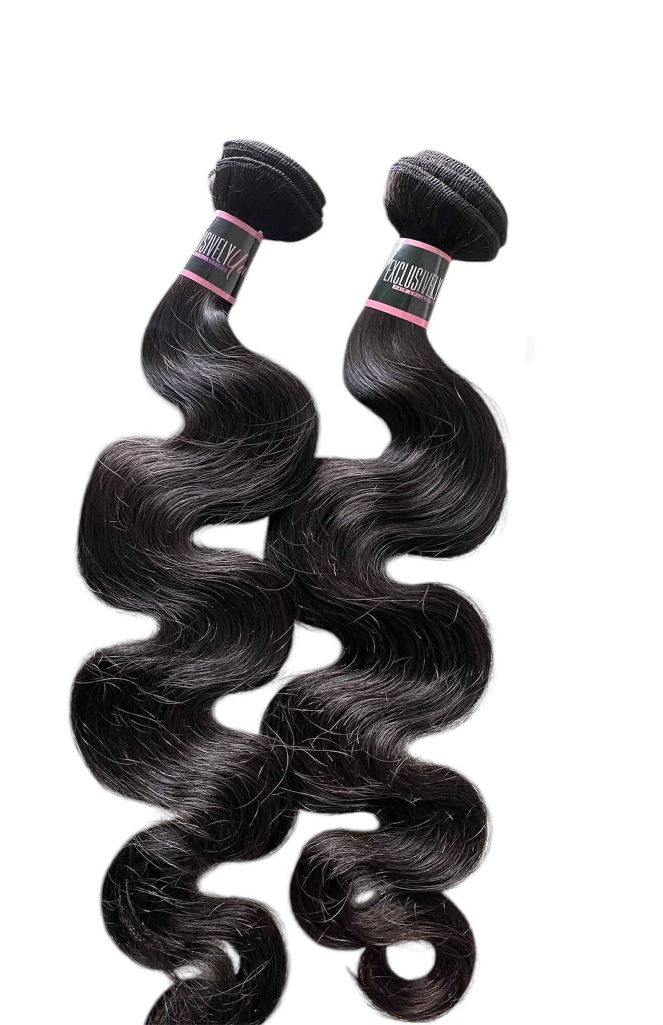 Two black hair extensions with loose curls, attached to black bands, hanging vertically against a white background.